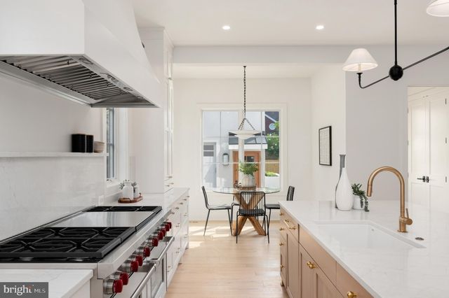 a living room with furniture fireplace and window