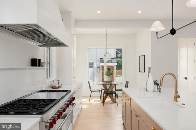 a living room with furniture fireplace and window