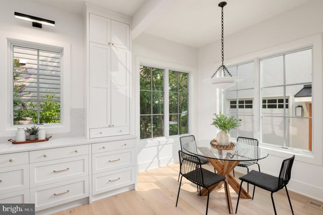 a view of a chairs and tables in the balcony