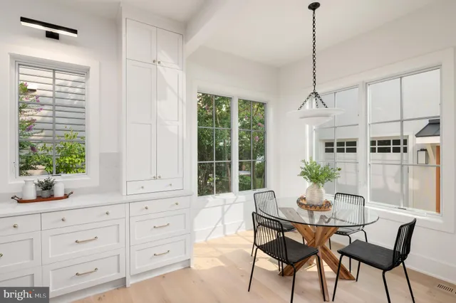 a view of a chairs and tables in the balcony