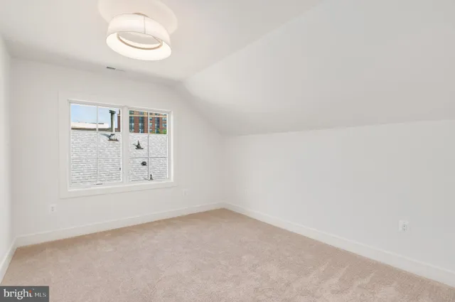 a front view of house with a garden and plants