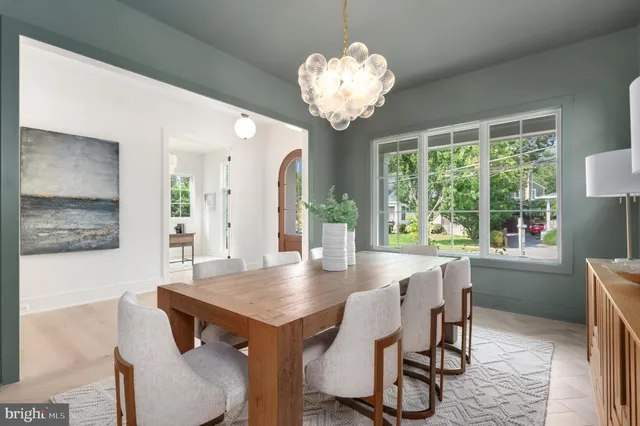 a living room with furniture a dining table and chairs