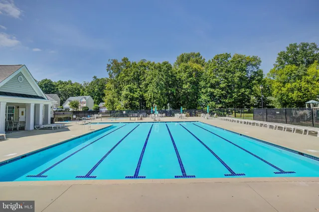 a view of a swimming pool with chairs