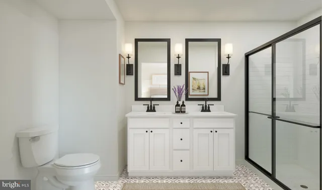 a bathroom with a double vanity sink and a mirror