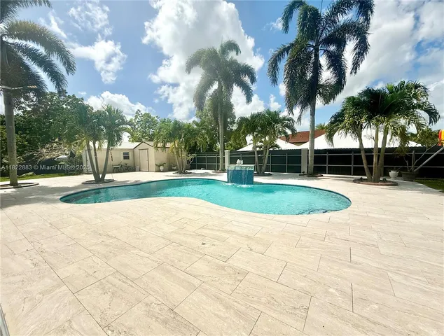 a view of a swimming pool with a garden