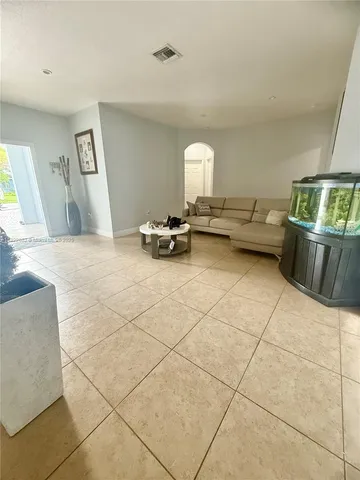 a view of living room with furniture and a table