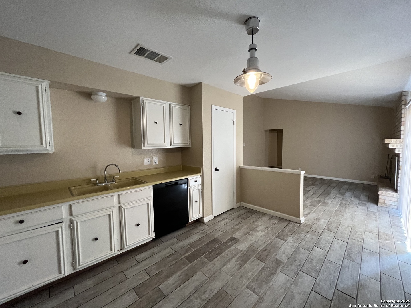 6522 Ridge Willow Drive San Antonio, TX 78233 - Photo 13 of 42 a large kitchen with granite countertop a stove a sink and a refrigerator