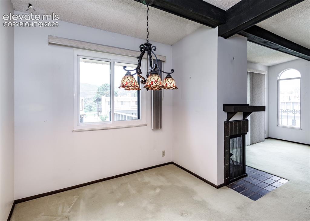1034 Fontmore Road, Unit D Colorado Springs, CO 80904 - Photo 20 of 43 a view of a livingroom with a chandelier