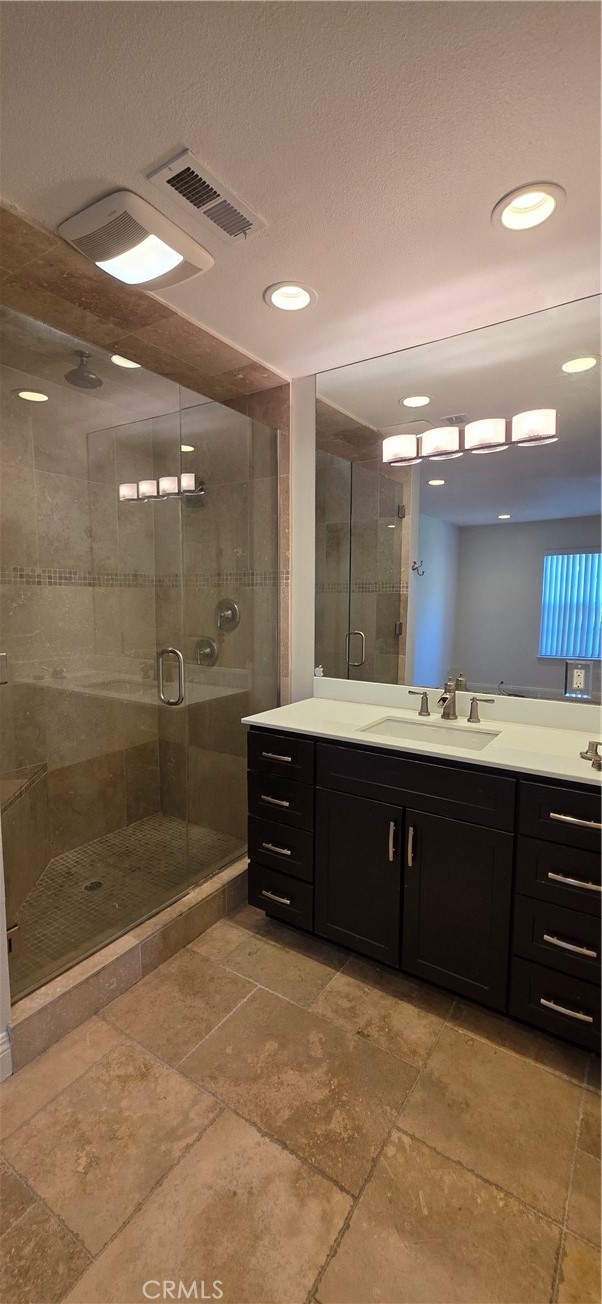 4823 Cobblestone Lane, Unit 24 Cypress, CA 90630 - Photo 11 of 26 a bathroom with a sink and a mirror