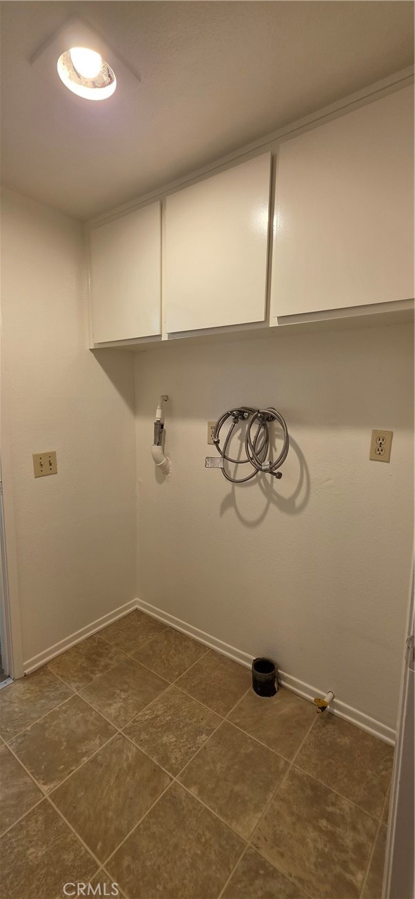 4823 Cobblestone Lane, Unit 24 Cypress, CA 90630 - Photo 14 of 26 a view of a utility room with racks on the wall