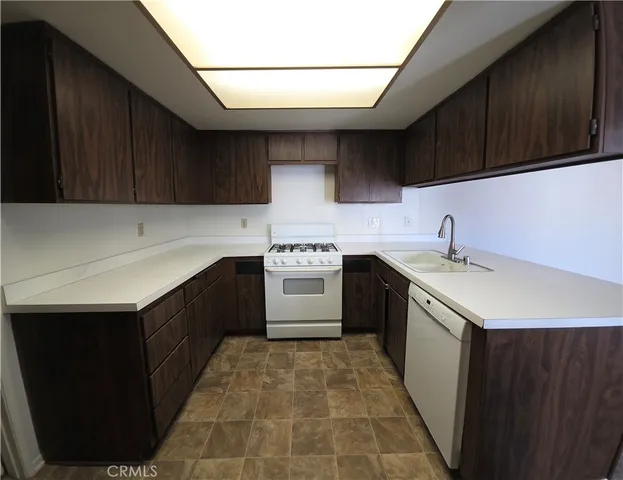 a kitchen with a cabinets and appliances