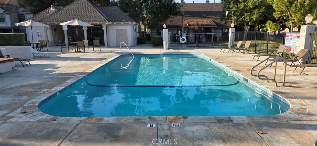4823 Cobblestone Lane, Unit 24 Cypress, CA 90630 - Photo 25 of 26 a view of a house with swimming pool