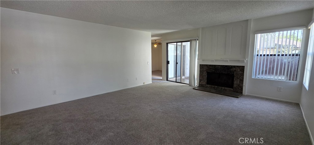 4823 Cobblestone Lane, Unit 24 Cypress, CA 90630 - Photo 3 of 26 an empty room with windows