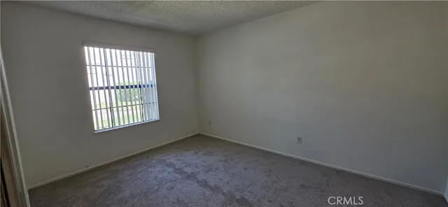 a bathroom with a glass shower door and a sink