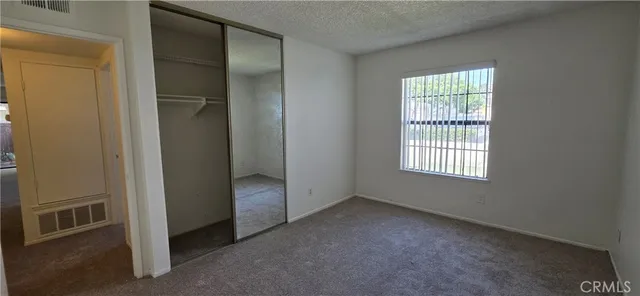 a view of an empty room with glass door