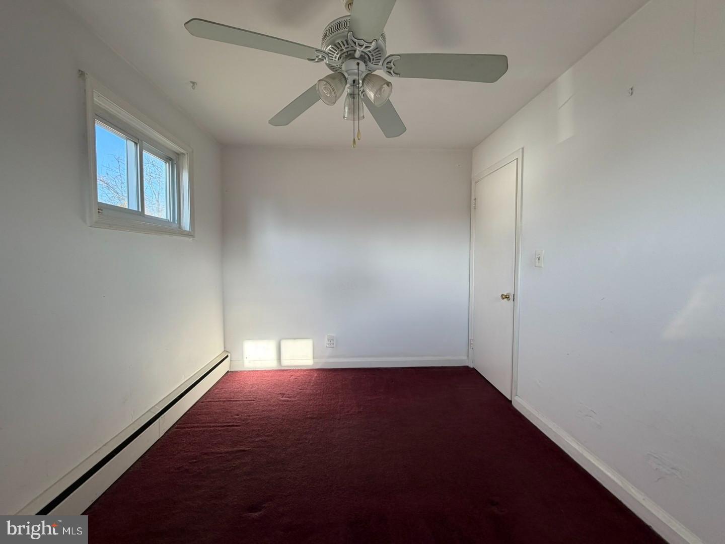 3829 Elmcroft Road Randallstown, MD 21133 - Photo 17 of 56 an empty room with a fan and a ceiling fan