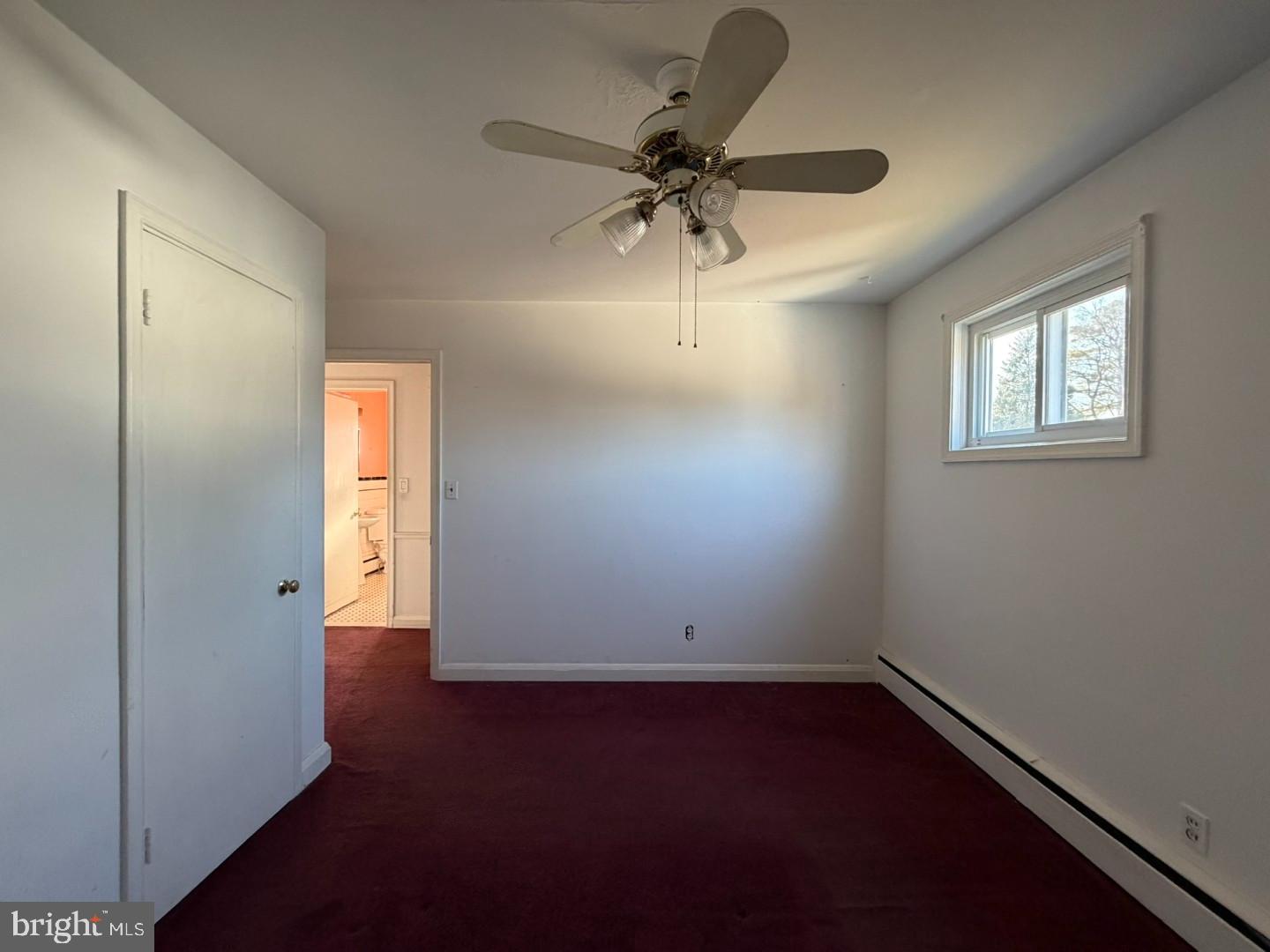 3829 Elmcroft Road Randallstown, MD 21133 - Photo 20 of 56 an empty room with closet and windows