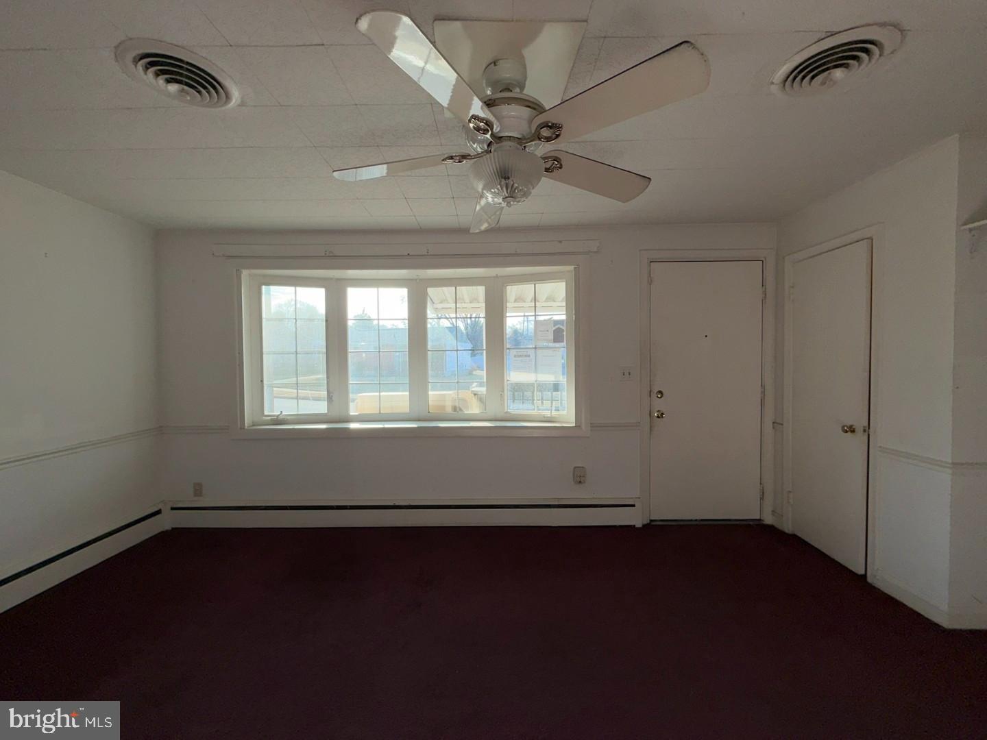 3829 Elmcroft Road Randallstown, MD 21133 - Photo 26 of 56 a view of an empty room with a window
