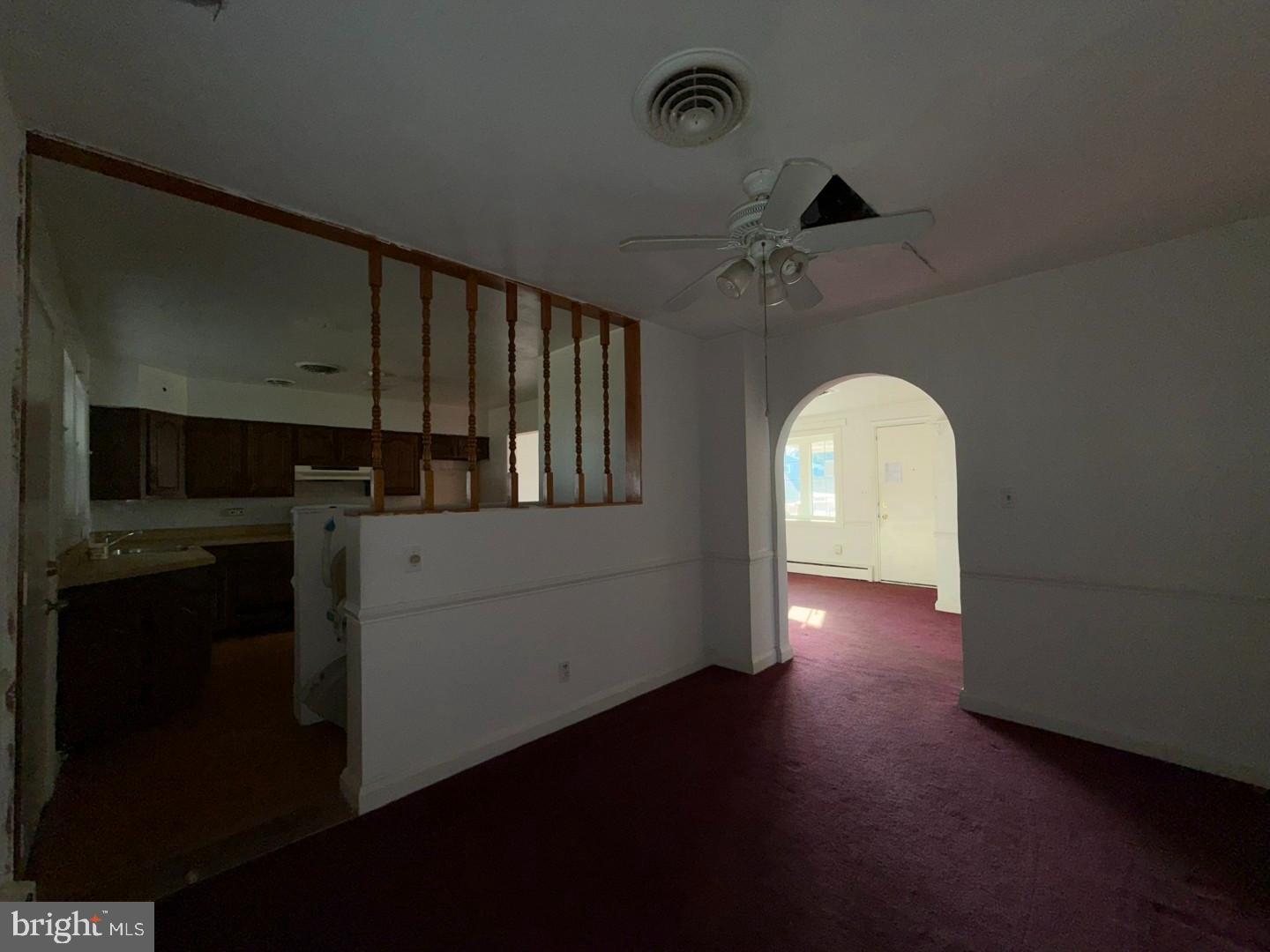 3829 Elmcroft Road Randallstown, MD 21133 - Photo 27 of 56 a view of kitchen and hall with wooden floor