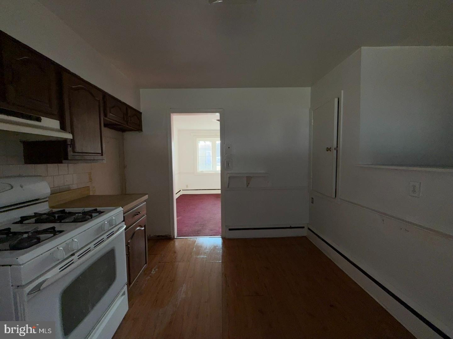 3829 Elmcroft Road Randallstown, MD 21133 - Photo 31 of 56 a kitchen with a stove and a microwave
