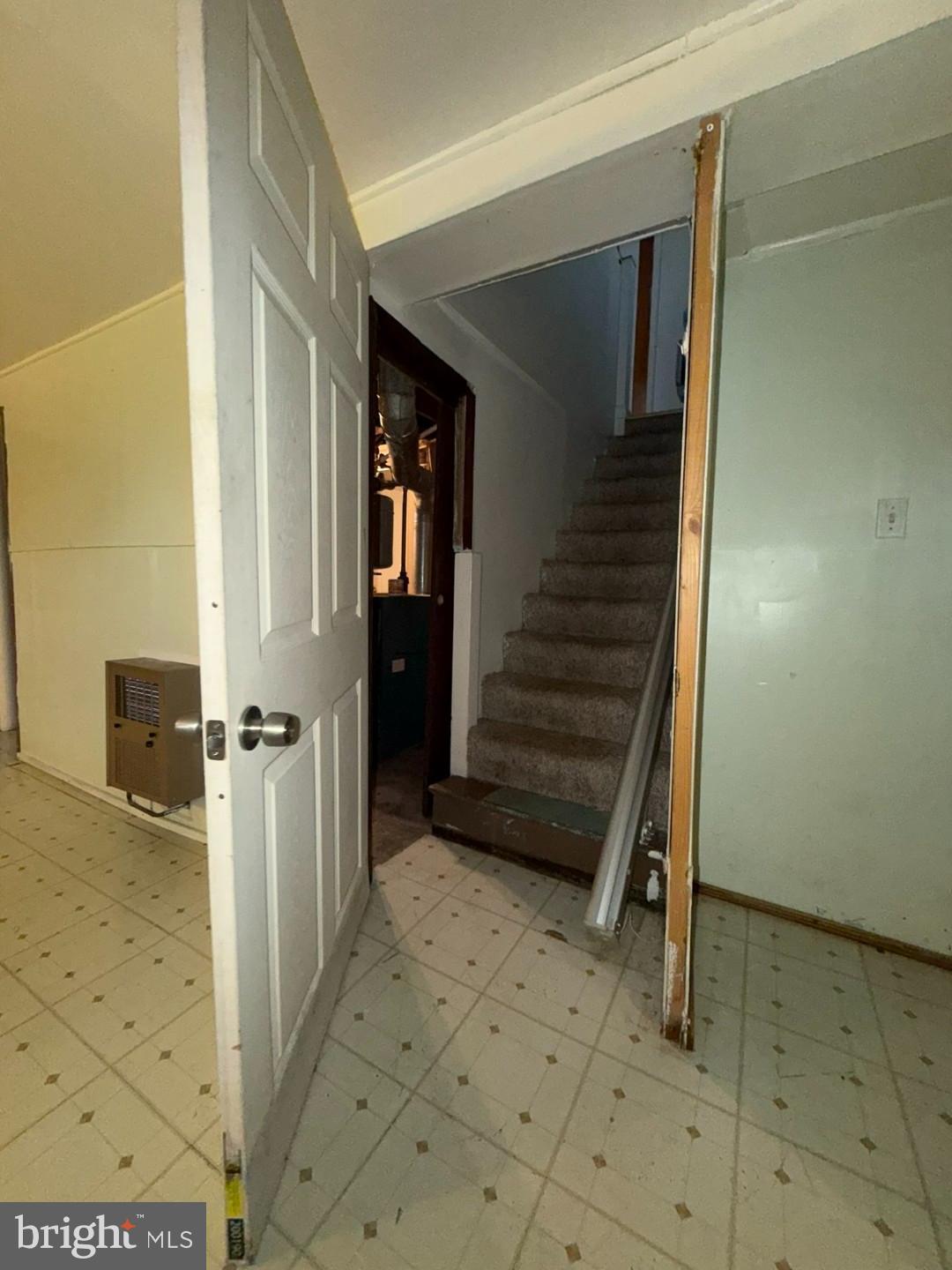 3829 Elmcroft Road Randallstown, MD 21133 - Photo 37 of 56 a view of a hallway with wooden walls and stairs