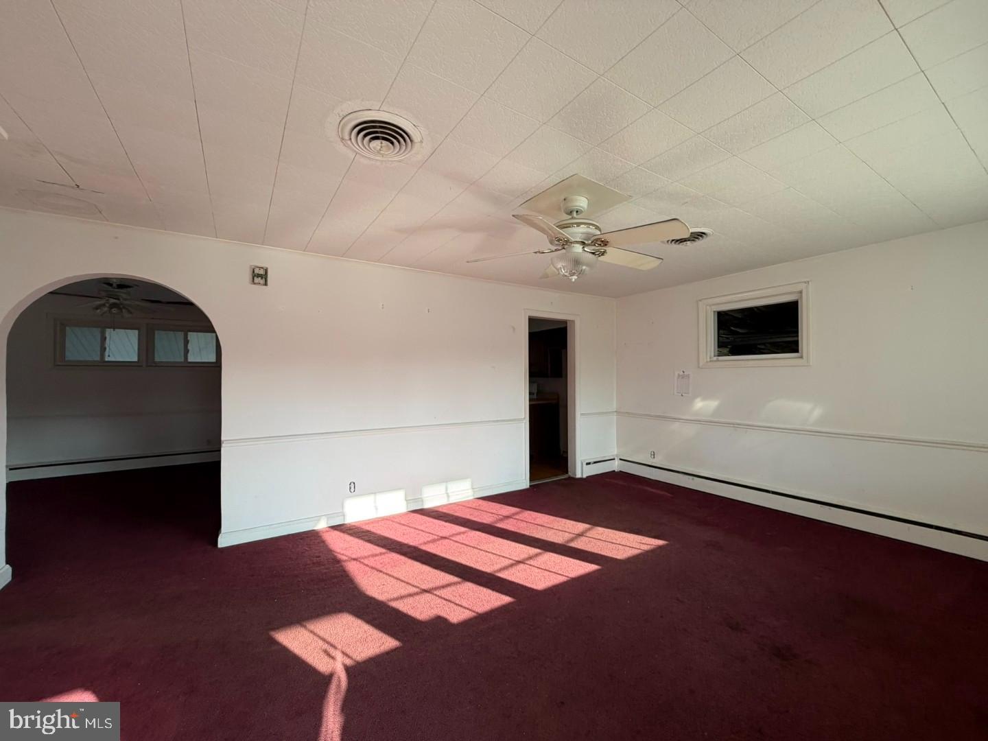 3829 Elmcroft Road Randallstown, MD 21133 - Photo 4 of 56 a bedroom with a bed and a view of kitchen