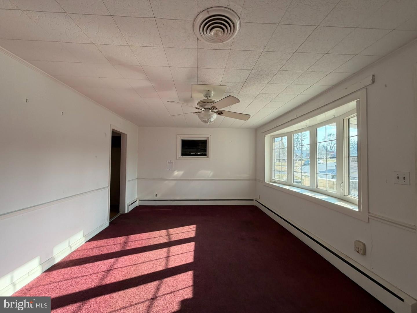 3829 Elmcroft Road Randallstown, MD 21133 - Photo 5 of 56 a view of a livingroom with a ceiling fan and window