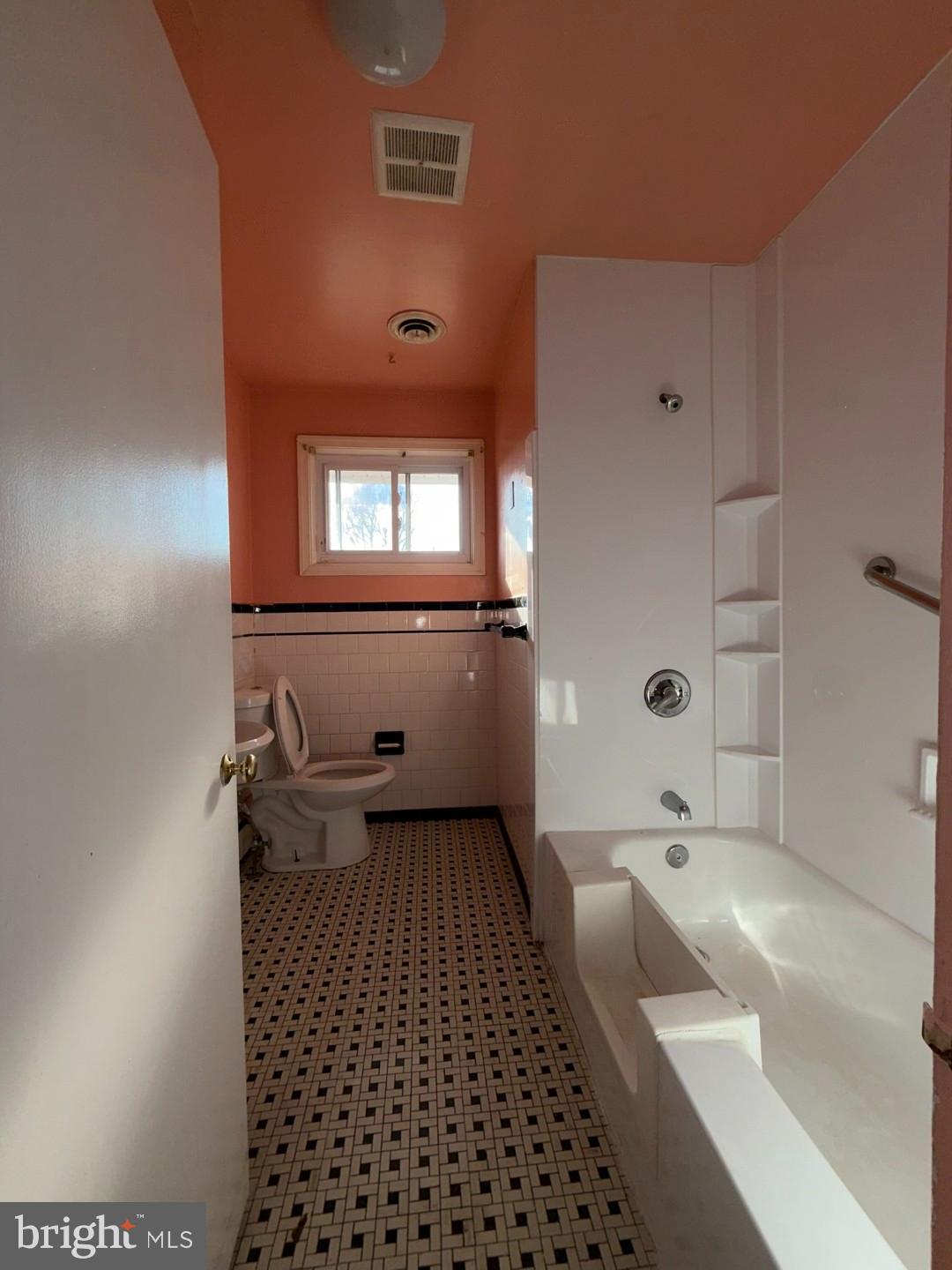 3829 Elmcroft Road Randallstown, MD 21133 - Photo 10 of 56 a bathroom with a sink a toilet and shower