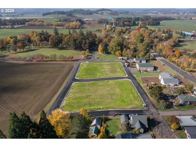 an aerial view of a house with a lake view