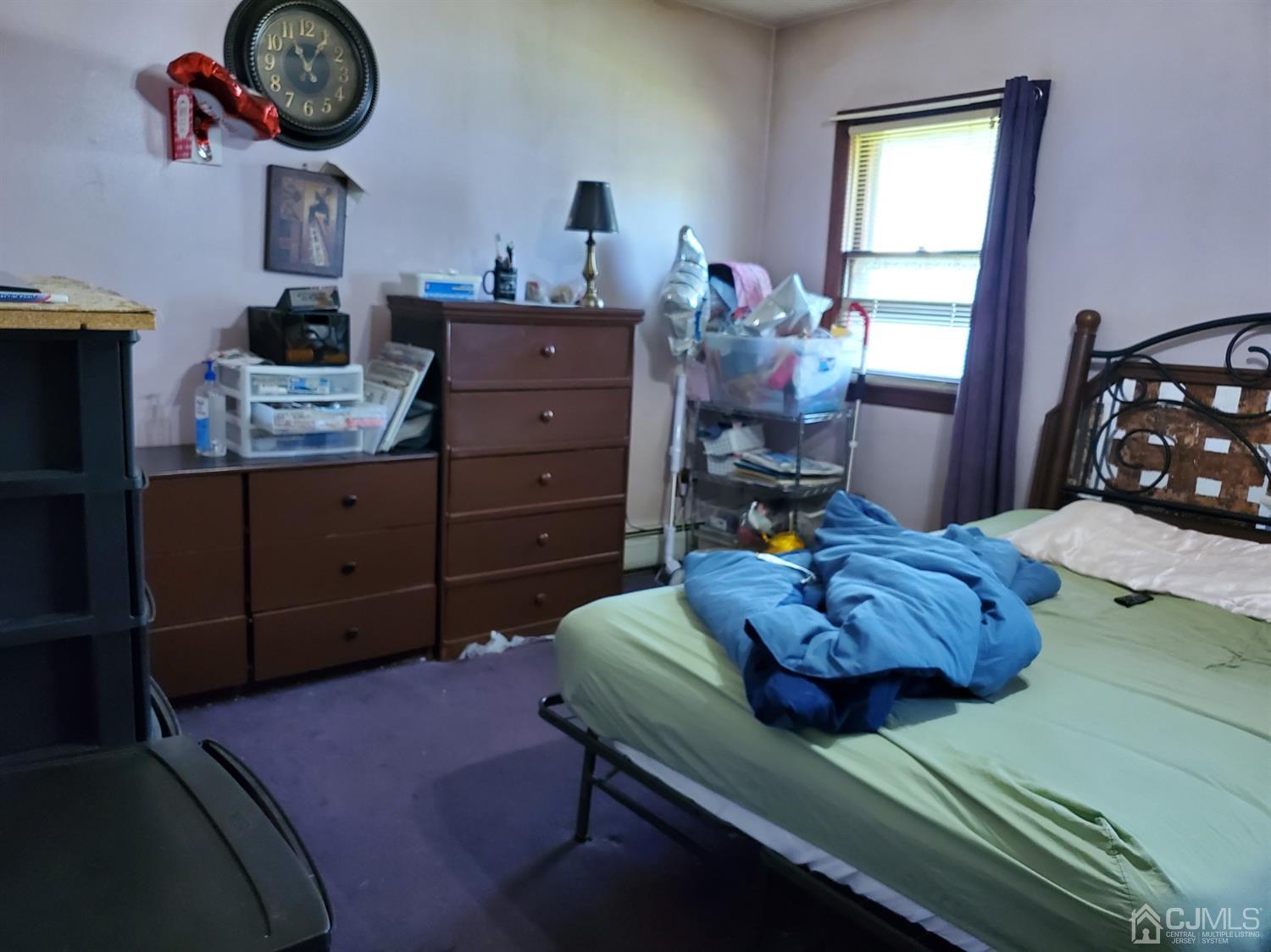 4 Mercury Road Edison, NJ 08817 - Photo 13 of 22 a bed room with a bed and a table