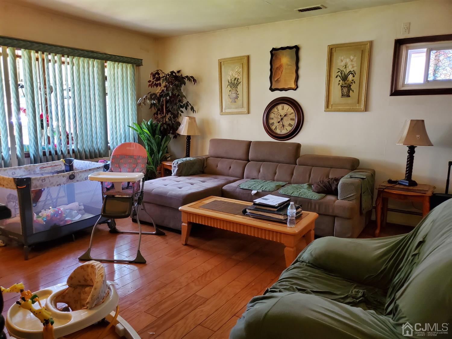 4 Mercury Road Edison, NJ 08817 - Photo 6 of 22 a living room with furniture and a window