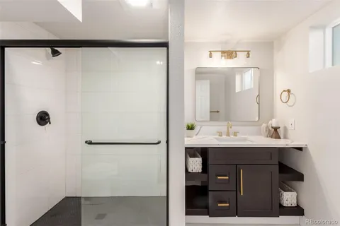 a bathroom with a sink and mirror
