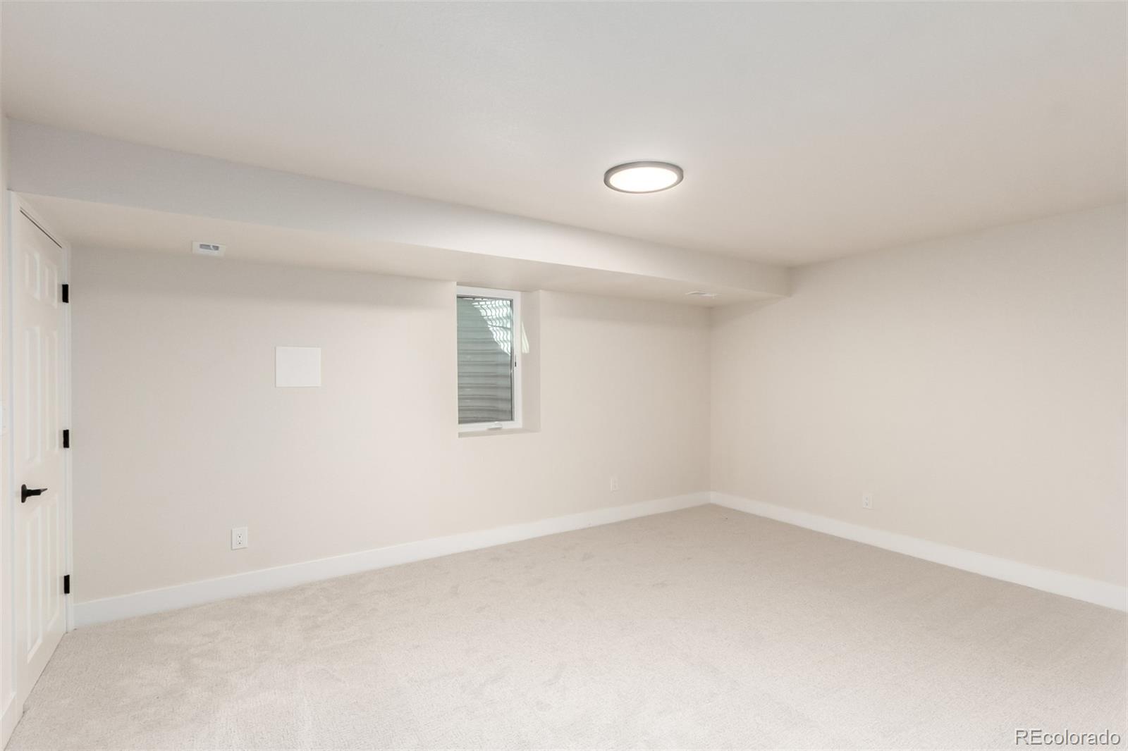 1760 South Dale Court Denver, CO 80219 - Photo 17 of 23 an empty room with a window