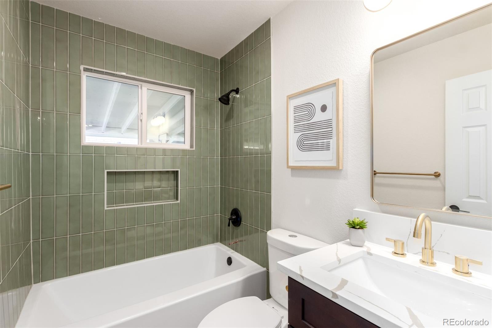 1760 South Dale Court Denver, CO 80219 - Photo 19 of 23 a bathroom with a granite countertop sink toilet and shower
