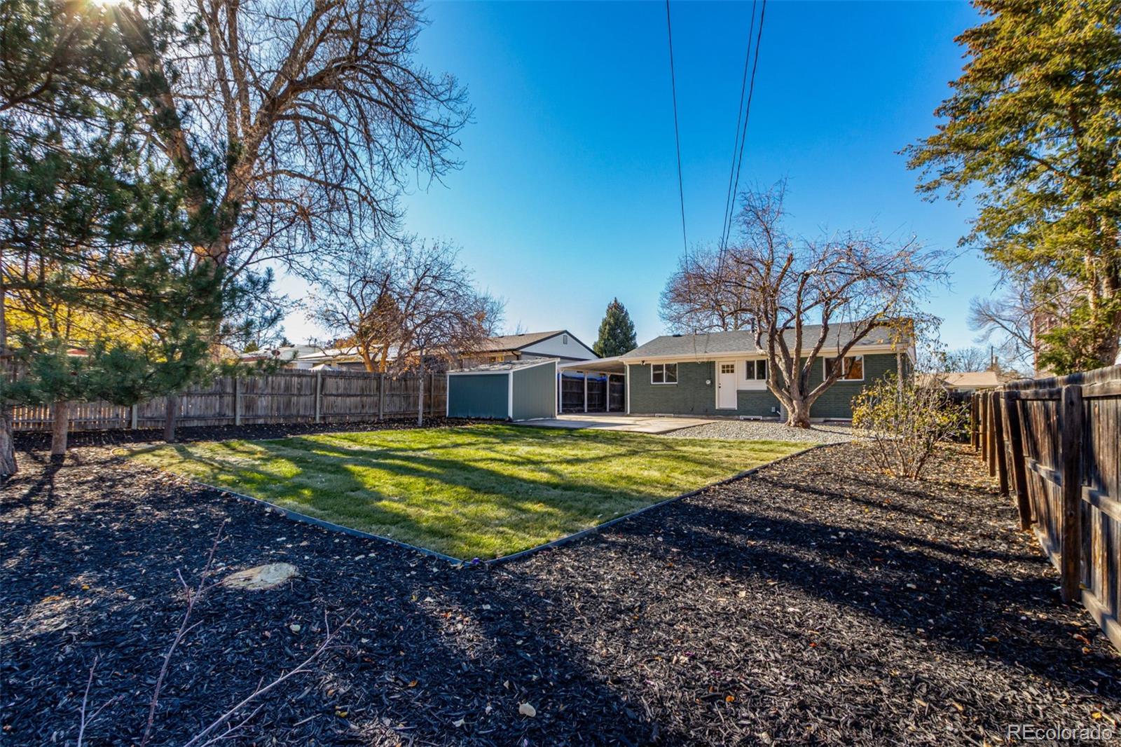 1760 South Dale Court Denver, CO 80219 - Photo 21 of 23 a view of a swimming pool with a yard