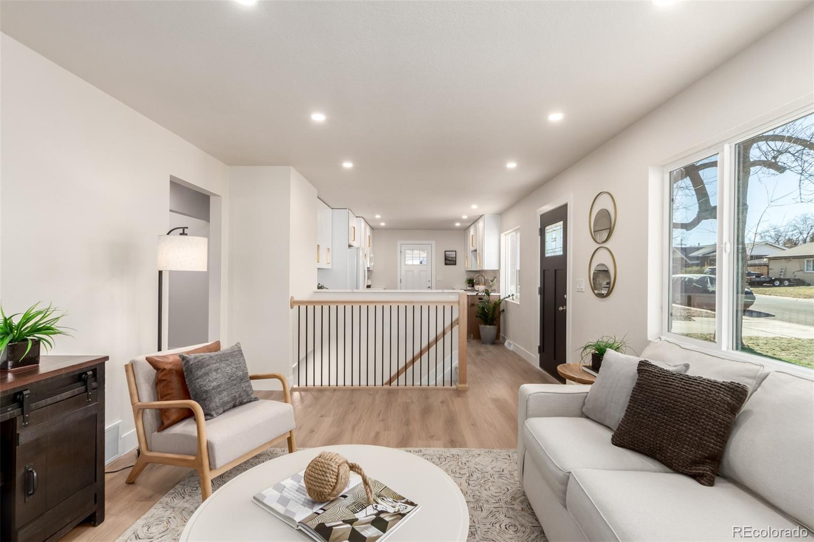 1760 South Dale Court Denver, CO 80219 - Photo 5 of 23 a living room with furniture and a wooden floor