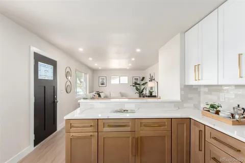 a view of kitchen with wooden floor