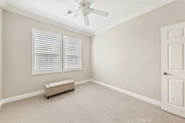 a view of room with a ceiling fan and window