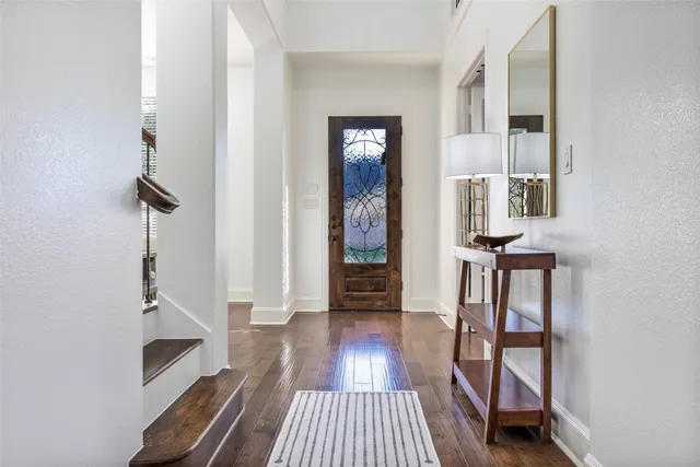 a view of front door with wooden floor
