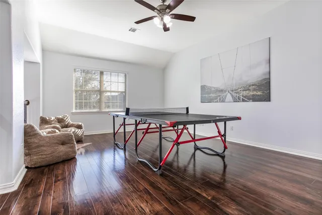 a work room with furniture and window