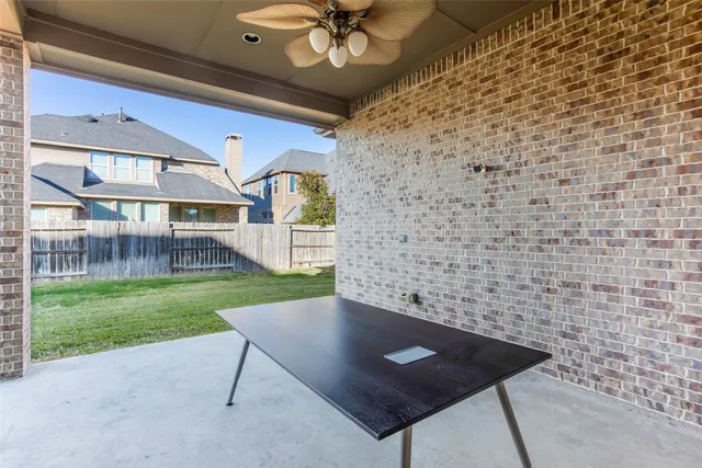 a view of backyard with a garden and entertaining space