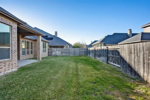 a view of backyard with green space