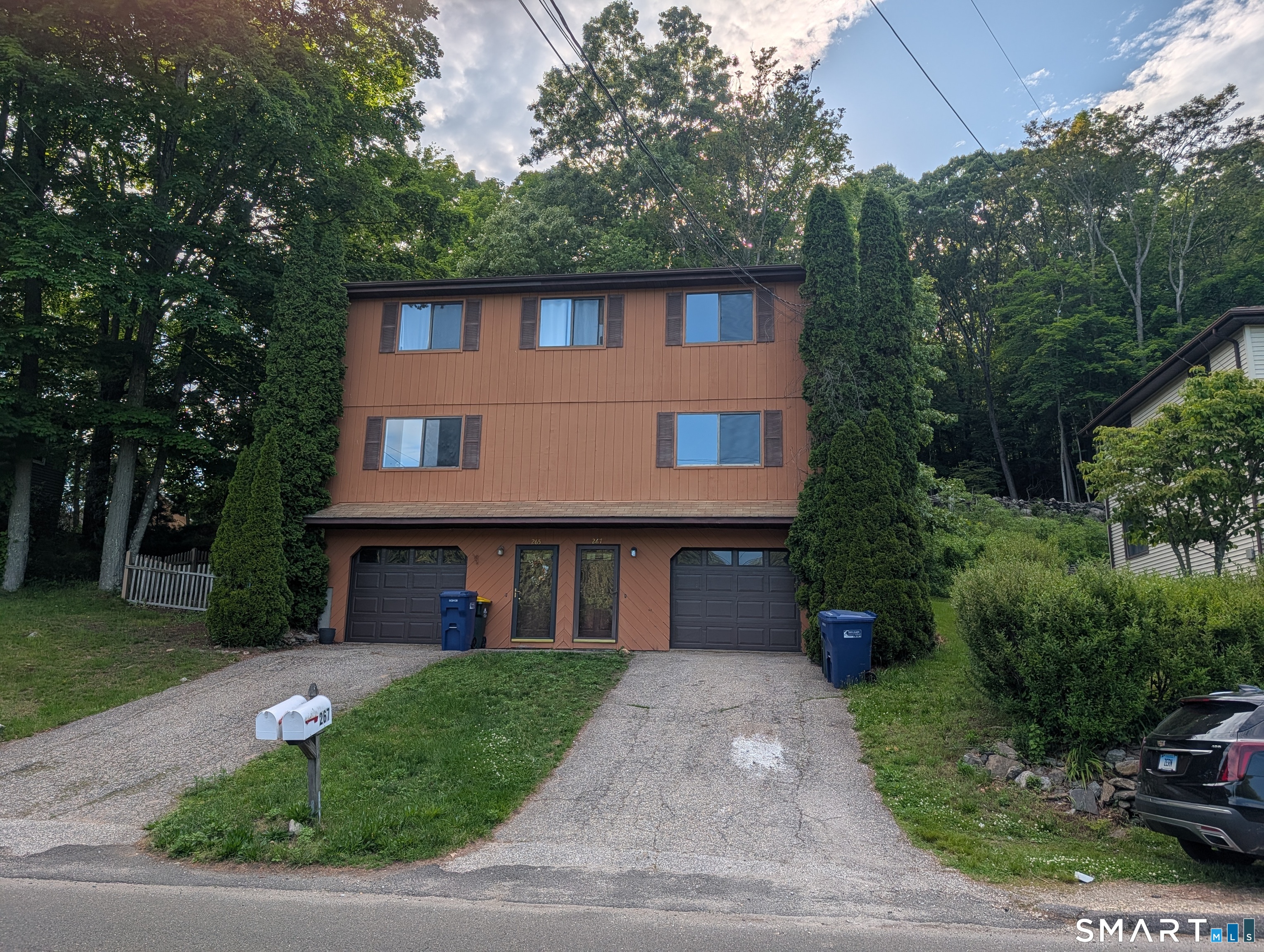 267 Beaver Street Ansonia, CT 06401 - Photo 1 of 12 a front view of a house with a garden