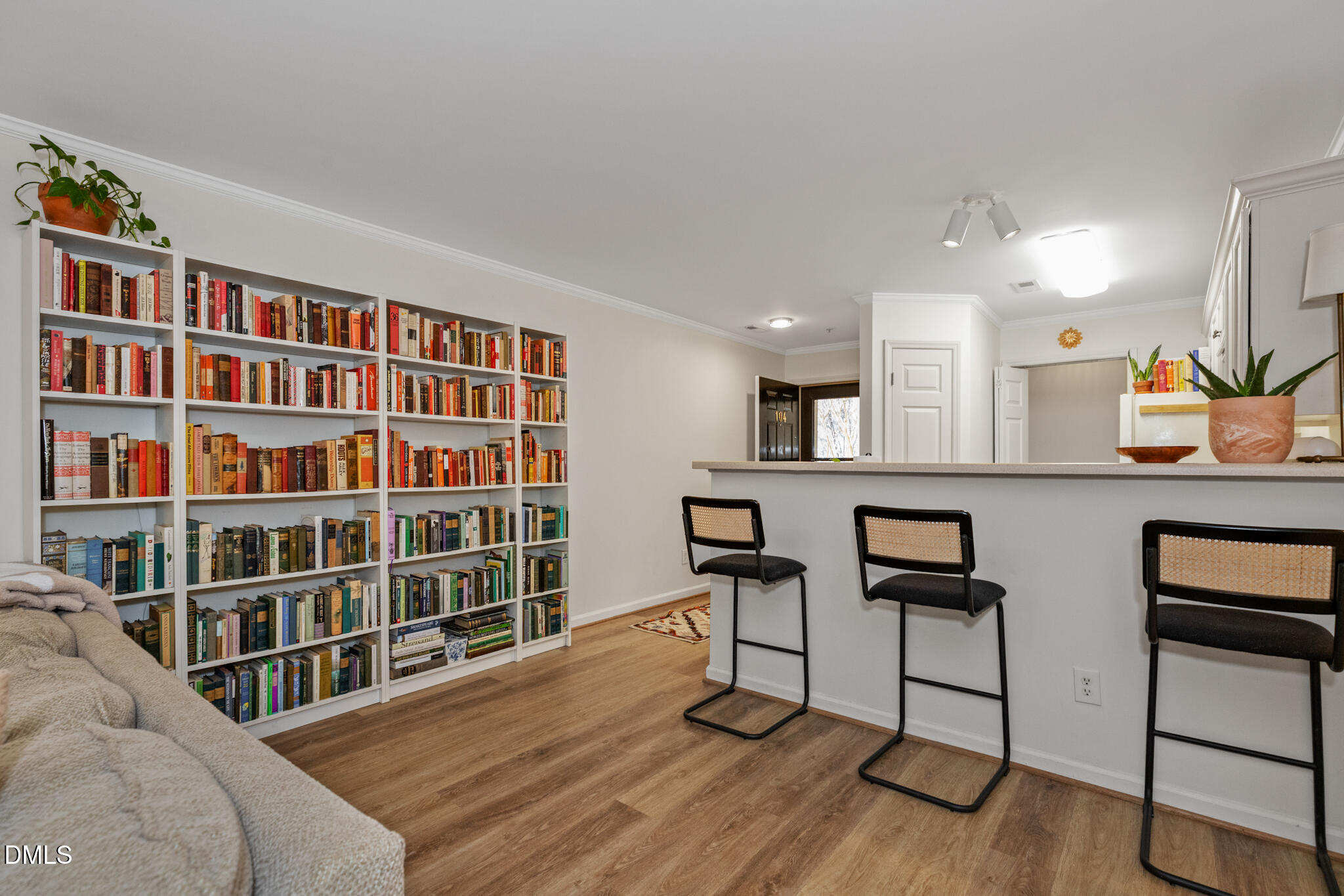 2950 Trailwood Pines Lane, Unit 104 Raleigh, NC 27603 - Photo 1 of 28 a livingroom with furniture wooden floor and windows