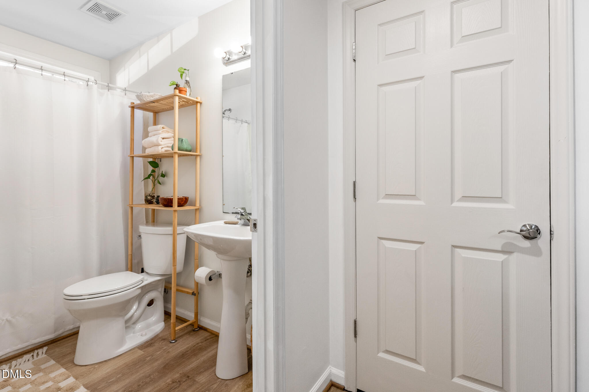 2950 Trailwood Pines Lane, Unit 104 Raleigh, NC 27603 - Photo 22 of 28 a bathroom with a sink toilet and shower