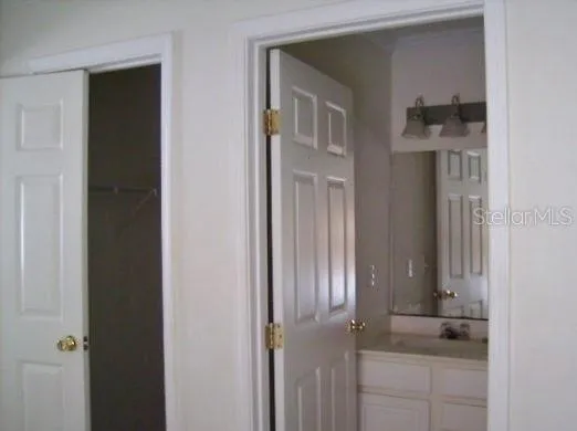 a bathroom with a granite countertop shower