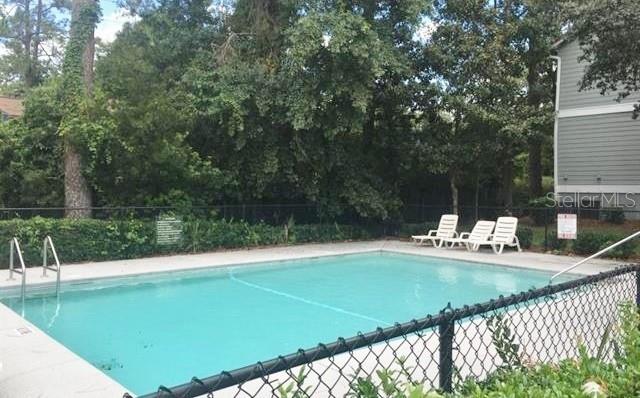 2905 Southwest Archer Road, Unit 4006 Gainesville, FL 32608 - Photo 7 of 8 a view of a balcony with yard