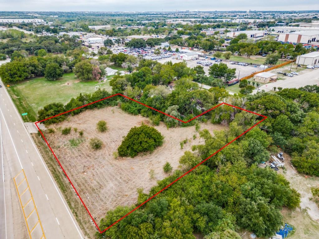 3321 Hardrock Road Grand Prairie, TX 75050 - Photo 3 of 7 an aerial view of residential houses with outdoor space and trees
