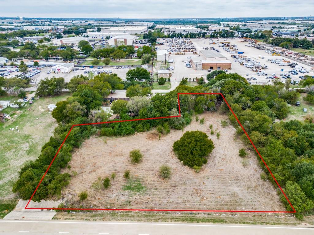 3321 Hardrock Road Grand Prairie, TX 75050 - Photo 4 of 7 an aerial view of residential houses with outdoor space