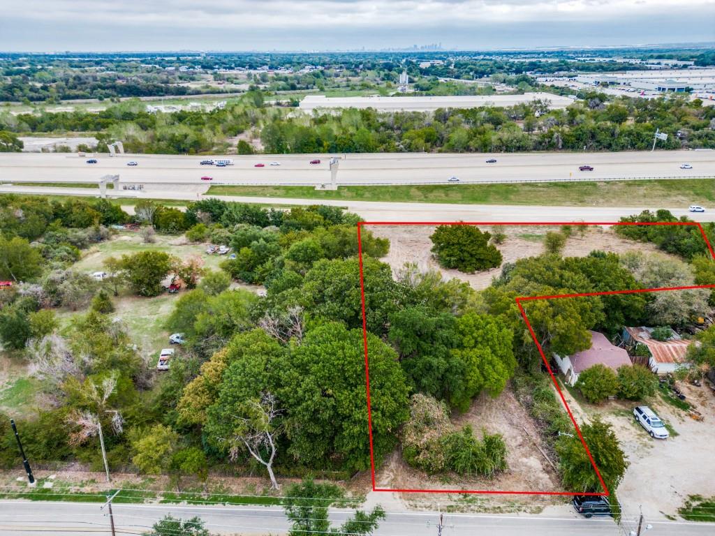 3321 Hardrock Road Grand Prairie, TX 75050 - Photo 5 of 7 an aerial view of a city with houses